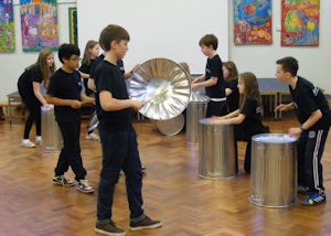 Boys and girls in a music lesson